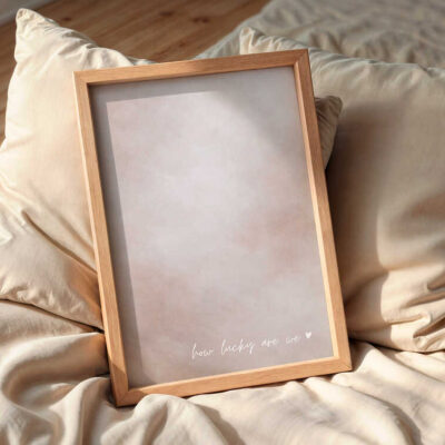 how-lucky-are-we-wall-art-frame-on-the-bed